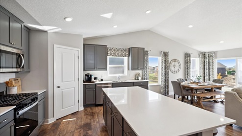 Open floor plan with vaulted ceilings.