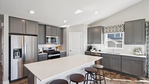 Kitchen with quartz countertops.