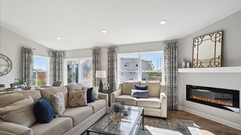Family room with electric fireplace.