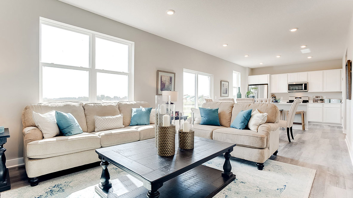 Open concept main level with the family room, dining and kitchen.