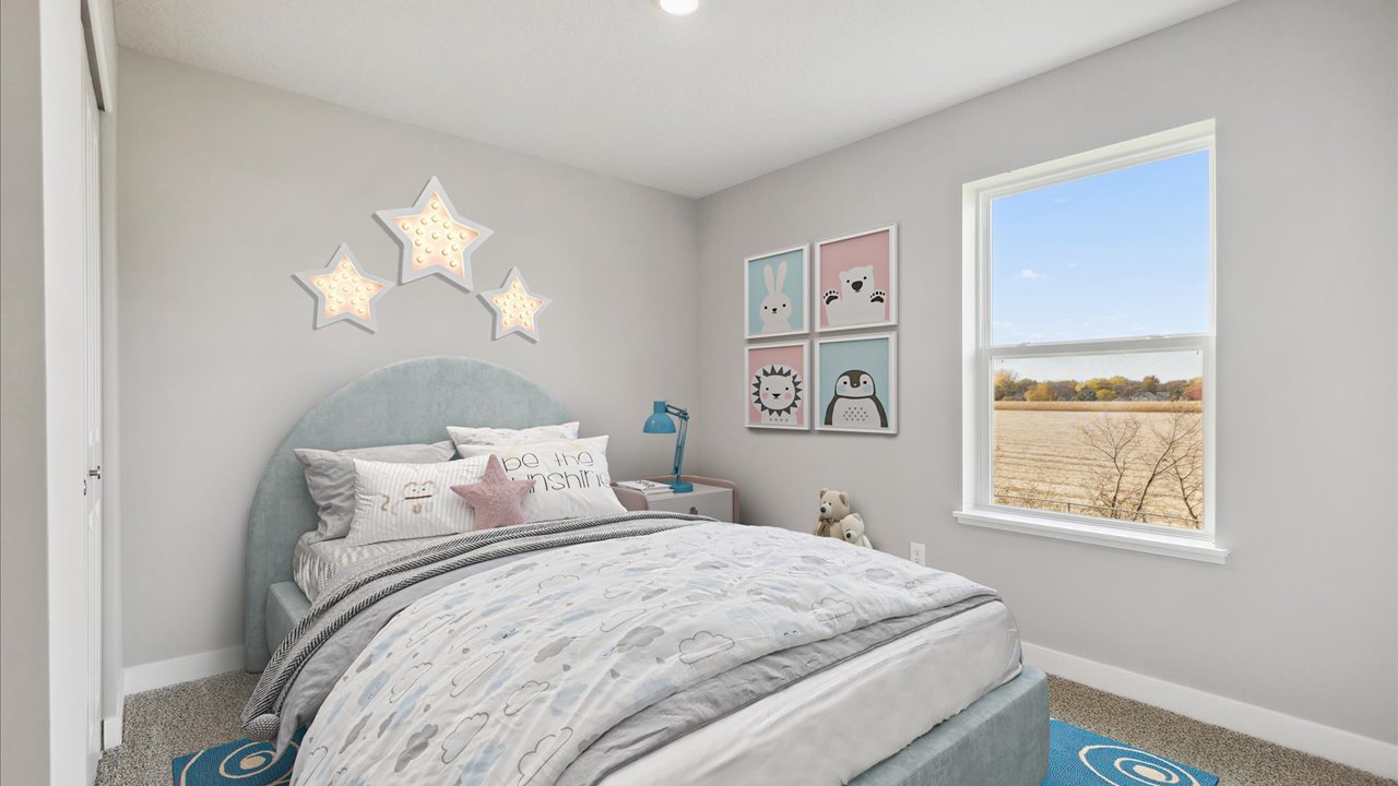 Carpeted secondary bedroom with standard closet.