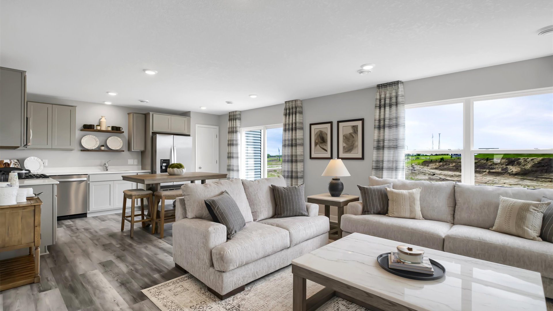 Open concept main level with hard flooring.