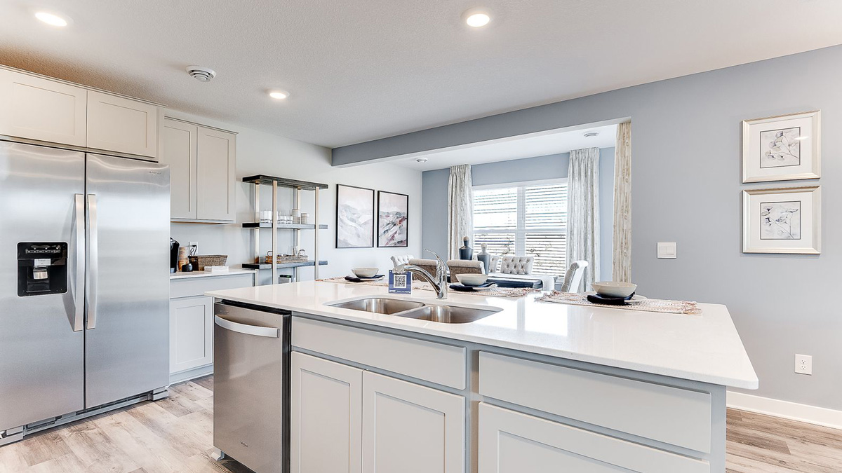 Kitchen island with built in stainless steel dishwasher.