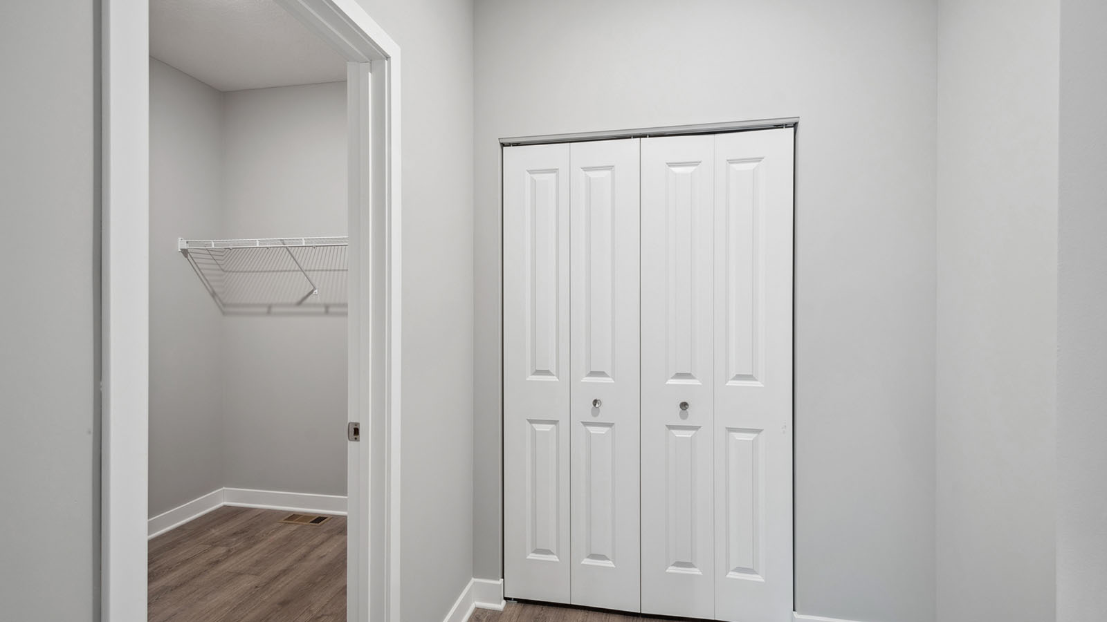 Walk in closet at garage entrance
