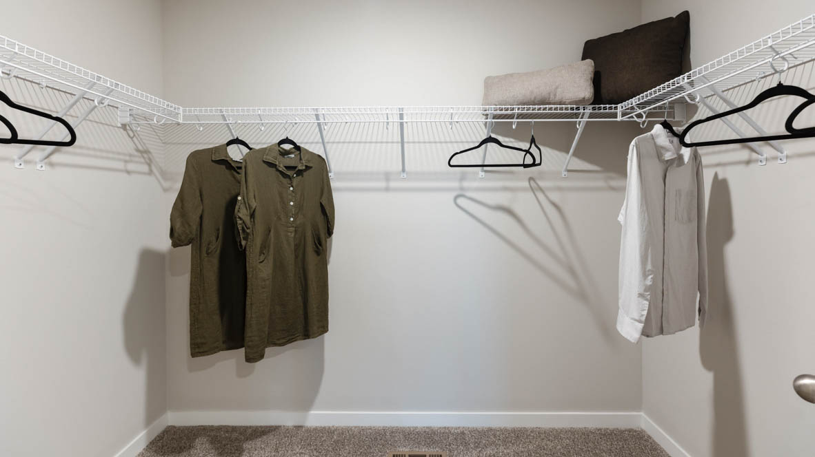 Owner’s ensuite adds quality storage inside this walk-in closet, designed for functional privacy