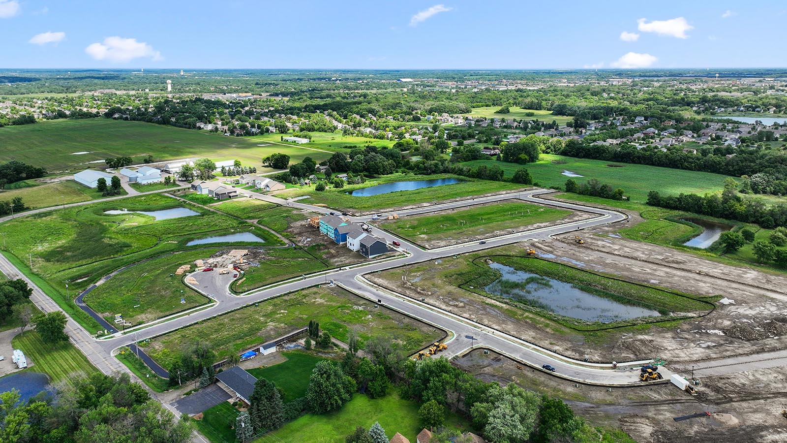 Aerial view of community, park and green space Big Woods Express By D.R. Horton