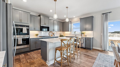 Stylish kitchen with harbor gray cabinets and stainless steel appliances