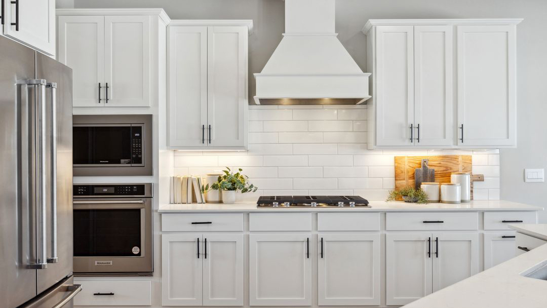 Kitchen with optional wood hood and gas cooktop.