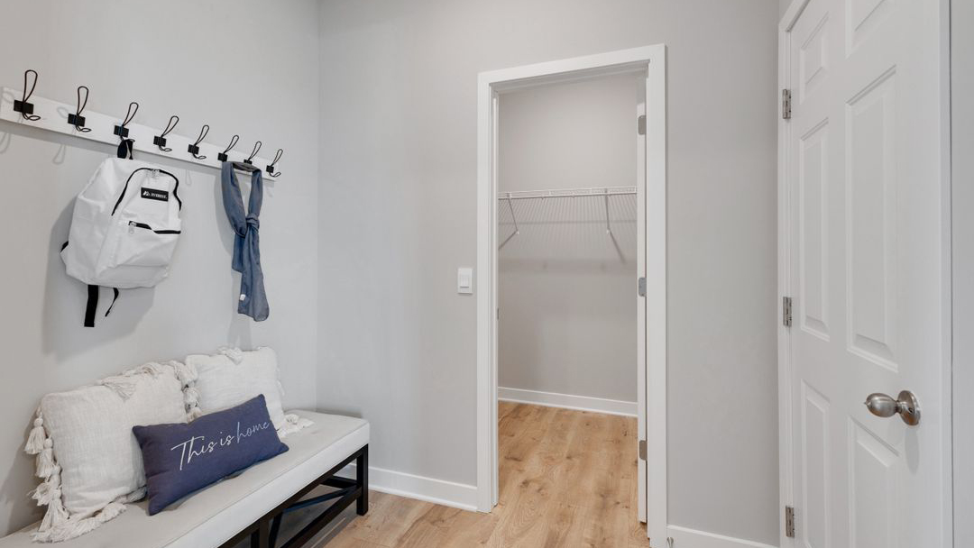 Mudroom with walk in closet.