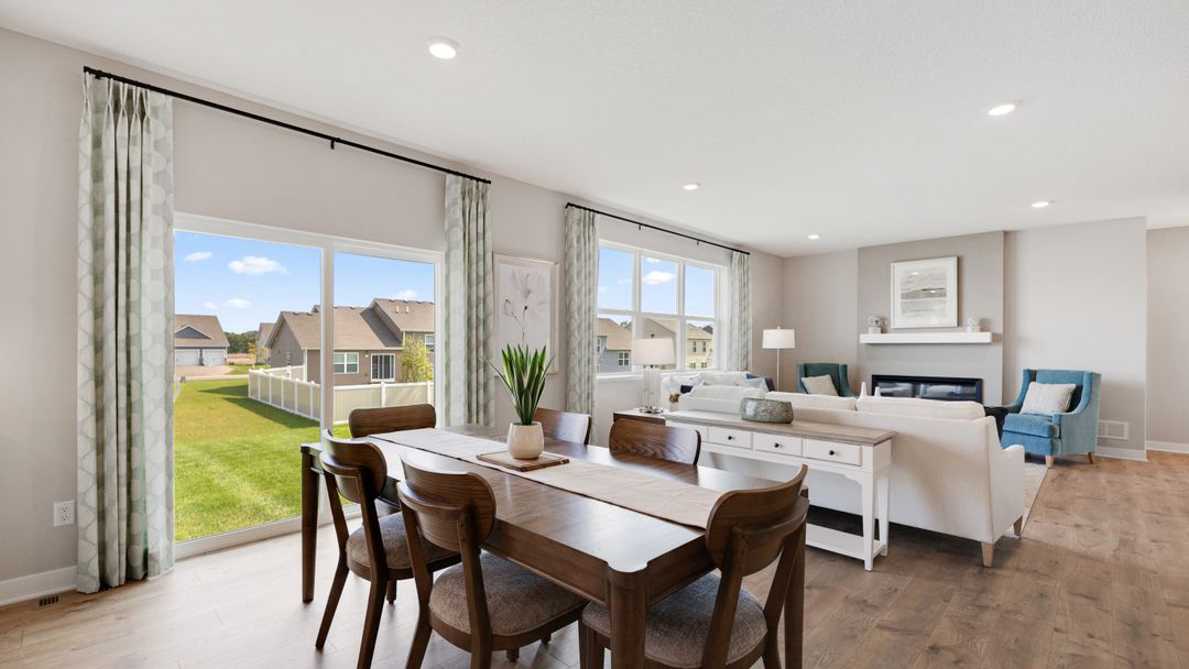 Dining area positioned between the kitchen and living room Prairie Pointe