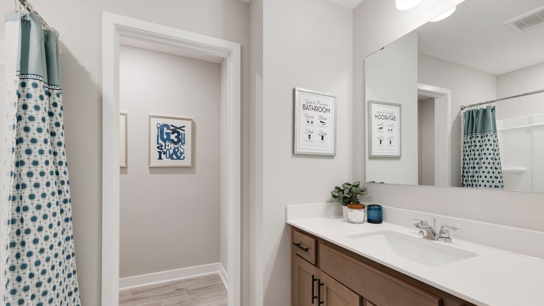 Third bathroom with vanity, tub, and shower combination Prairie Pointe