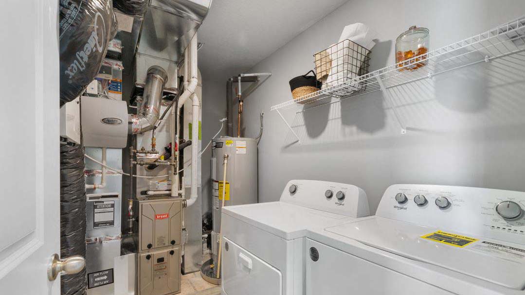 Upper level laundry room with wire shelving unit