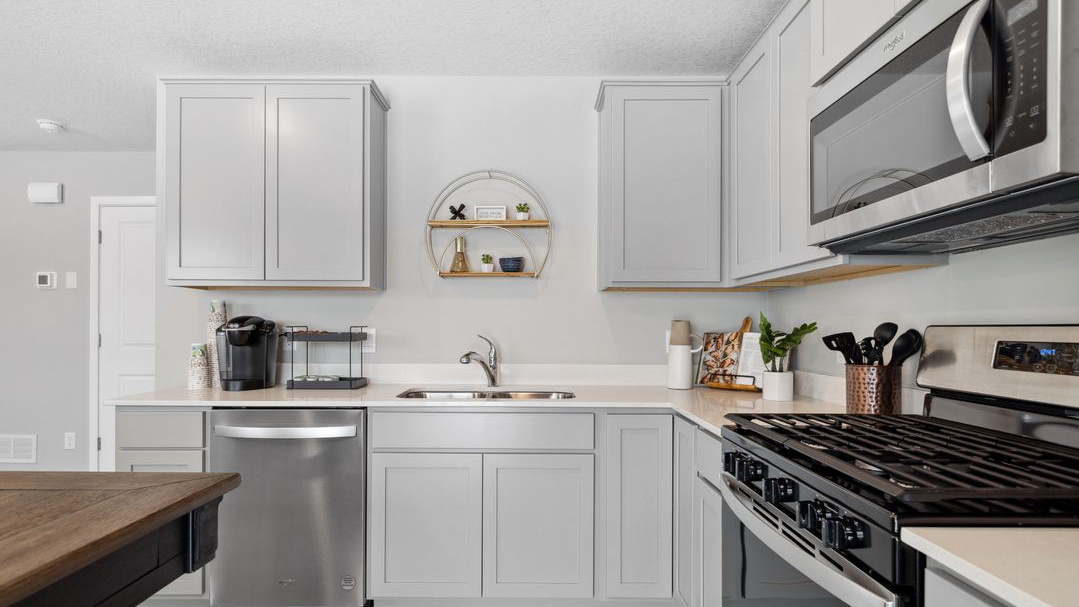 Side view of kitchen cabinetry and kitchen table.
