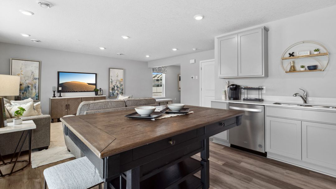 View of open concept main level from kitchen area.