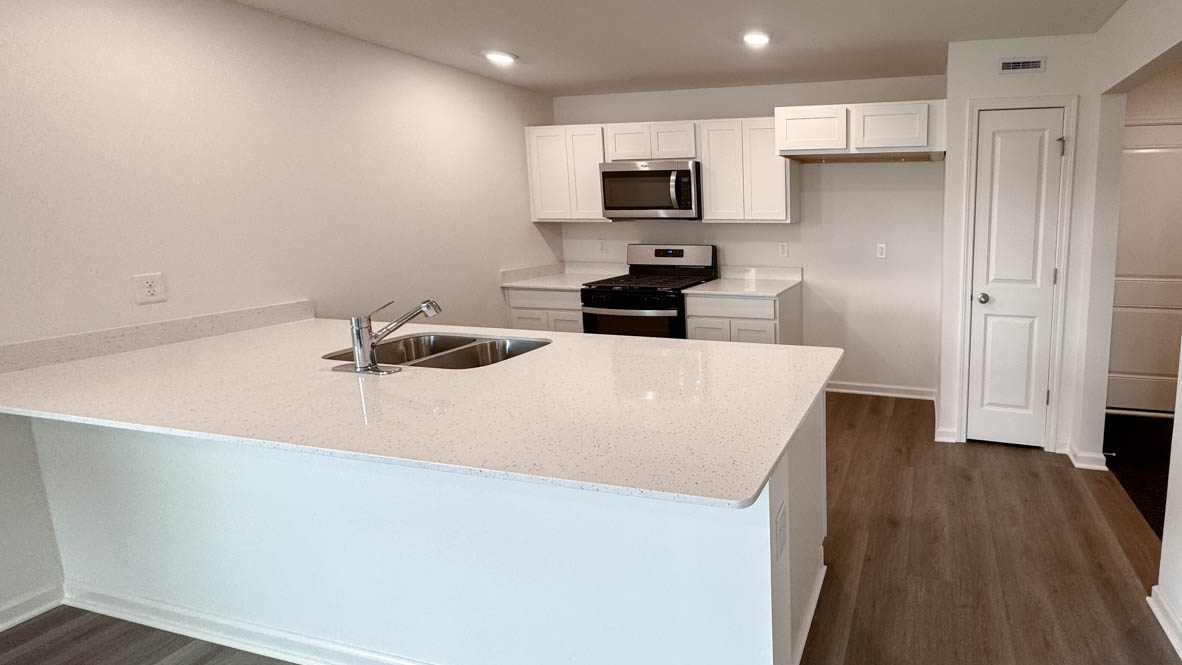 open concept kitchen with stainless steel appliances