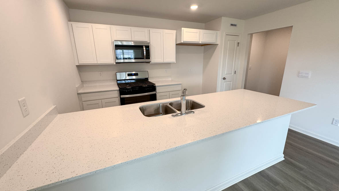 open concept kitchen with stainless steel appliances