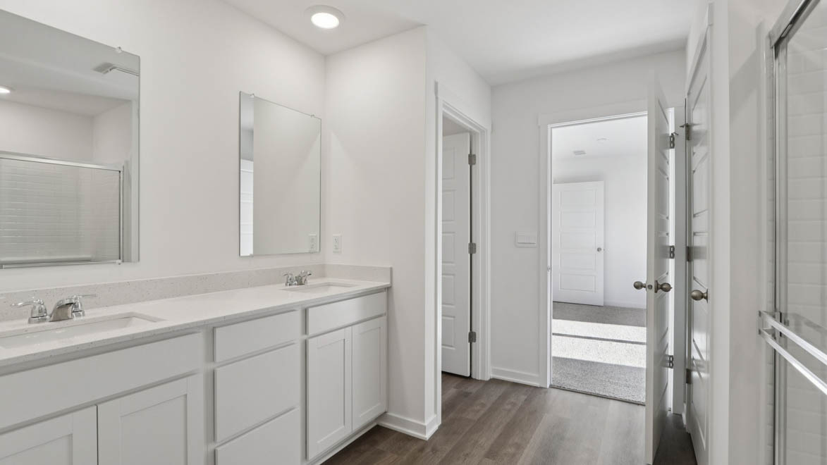 Primary bathroom with water closet and linene closet