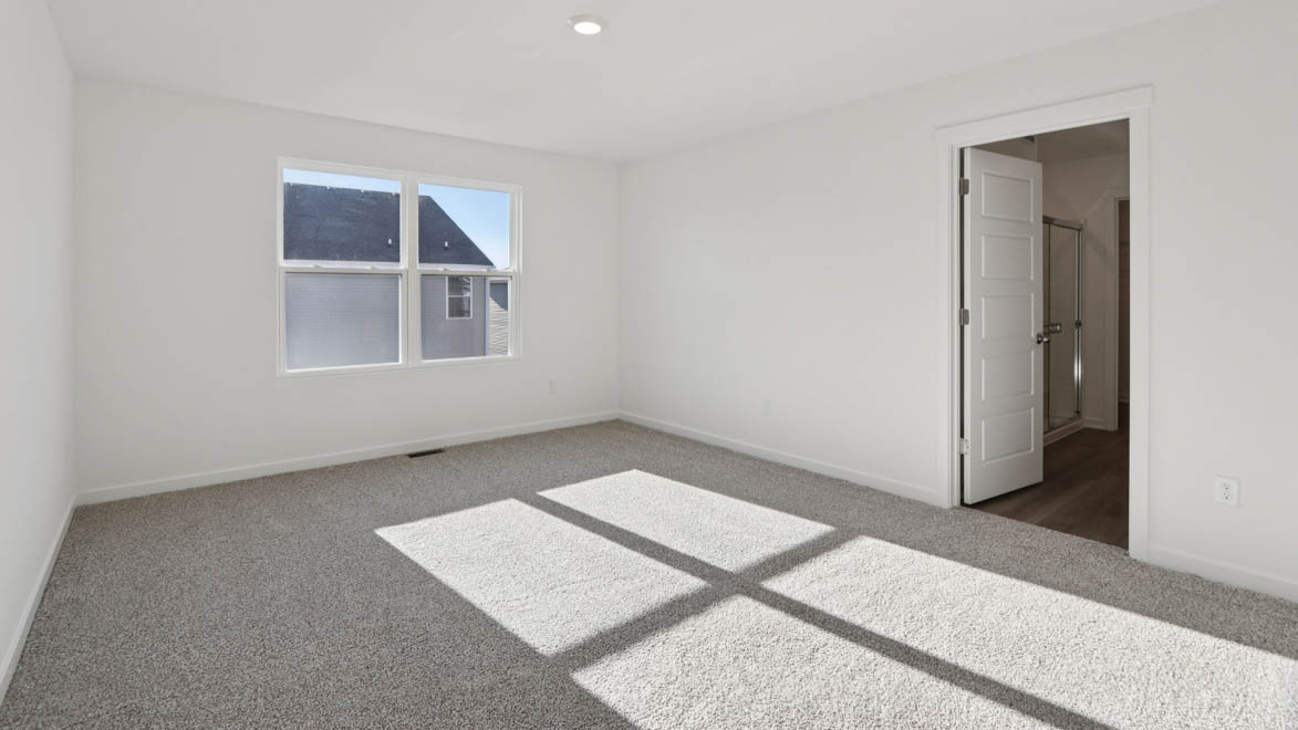 Primary bedroom with connecting en suite