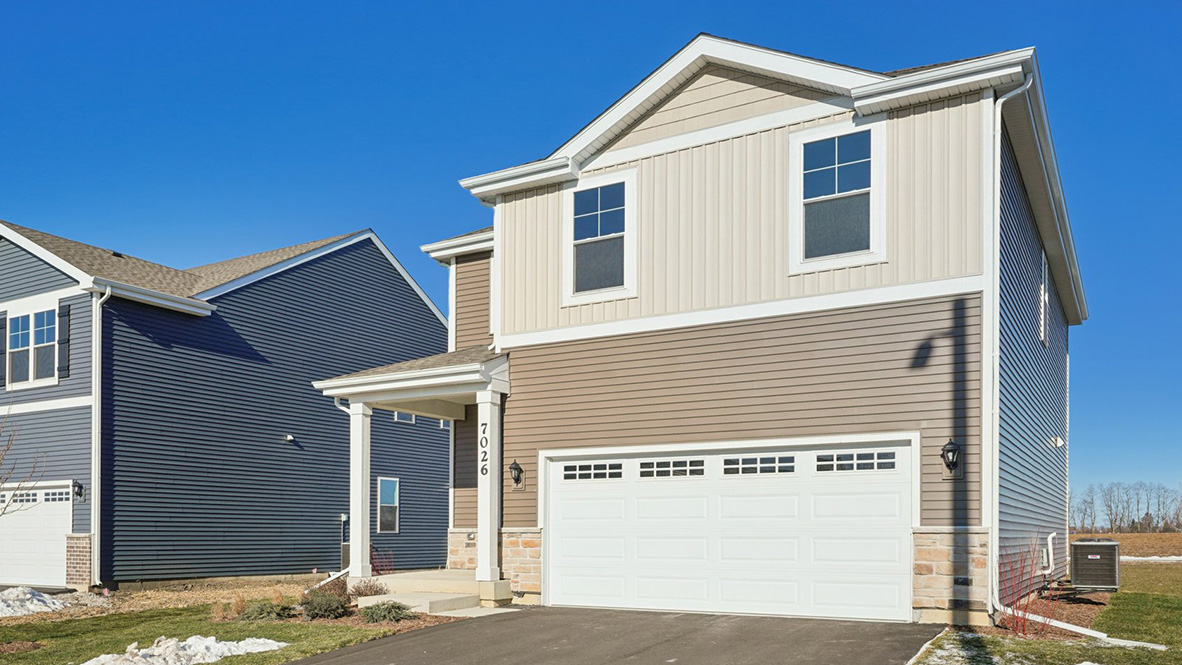 Exterior of sloan model with paved driveway and 2 car garage