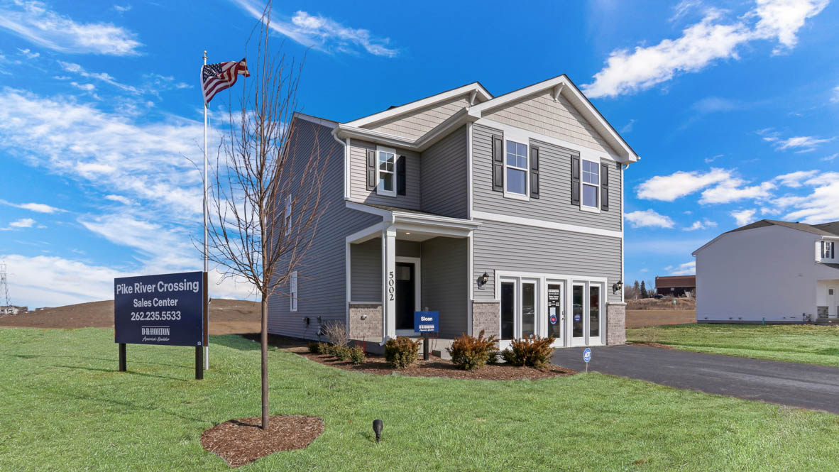 Sloan model with fully sodded yard and landscape