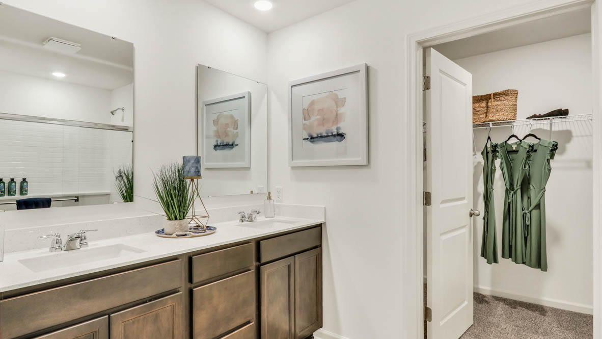 Primary bathroom with dual vanity and quartz countertop