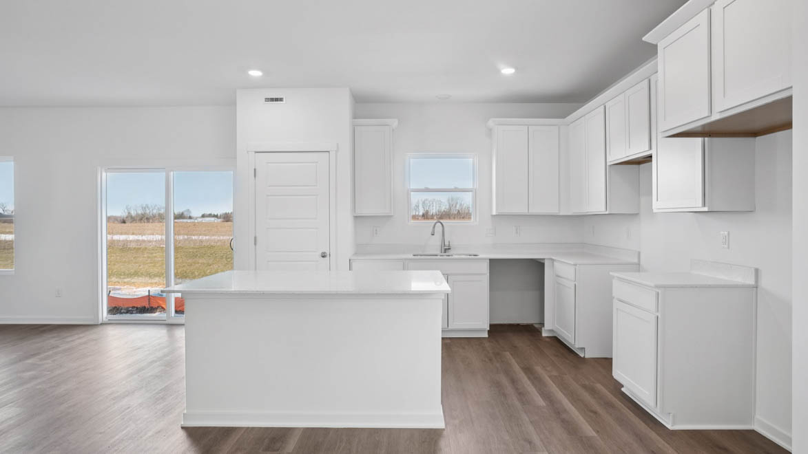 Kitchen with white 42 inch cabinets and white quartz countertops