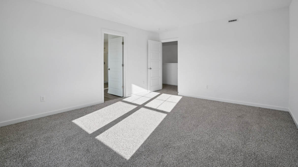 Primary bedroom with connecting en suite