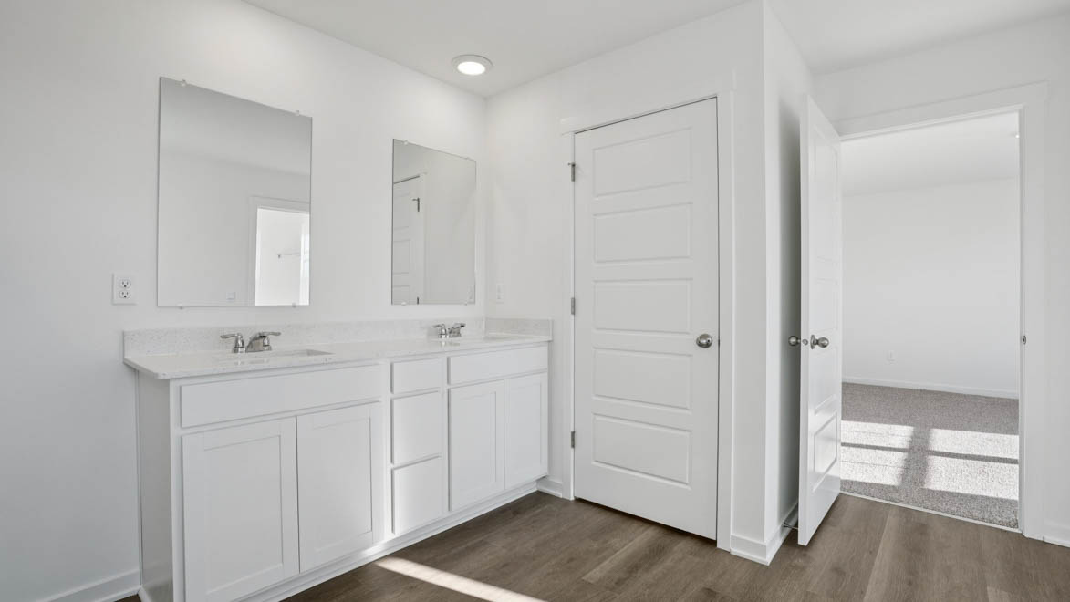 Dual sinks with white cabinets