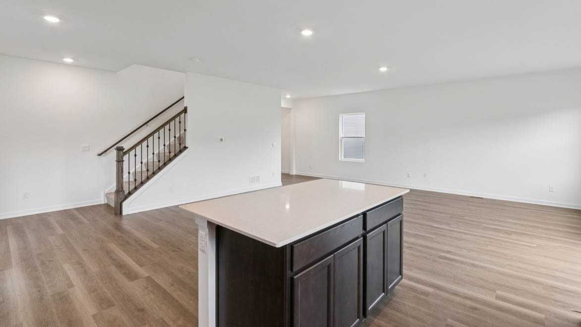 Kitchen with large island overlooking dining room