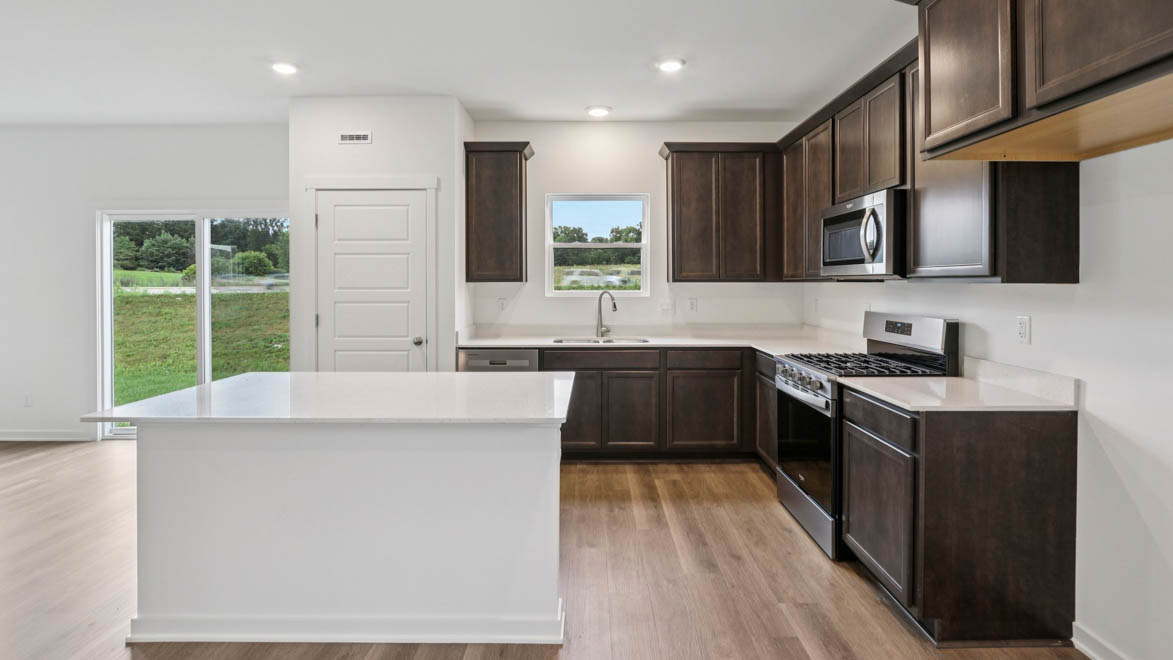 Kitchen with 42 inch cabinets and crown molding