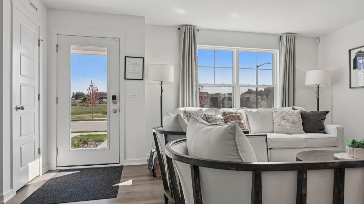 front door and entry into spacious living room
