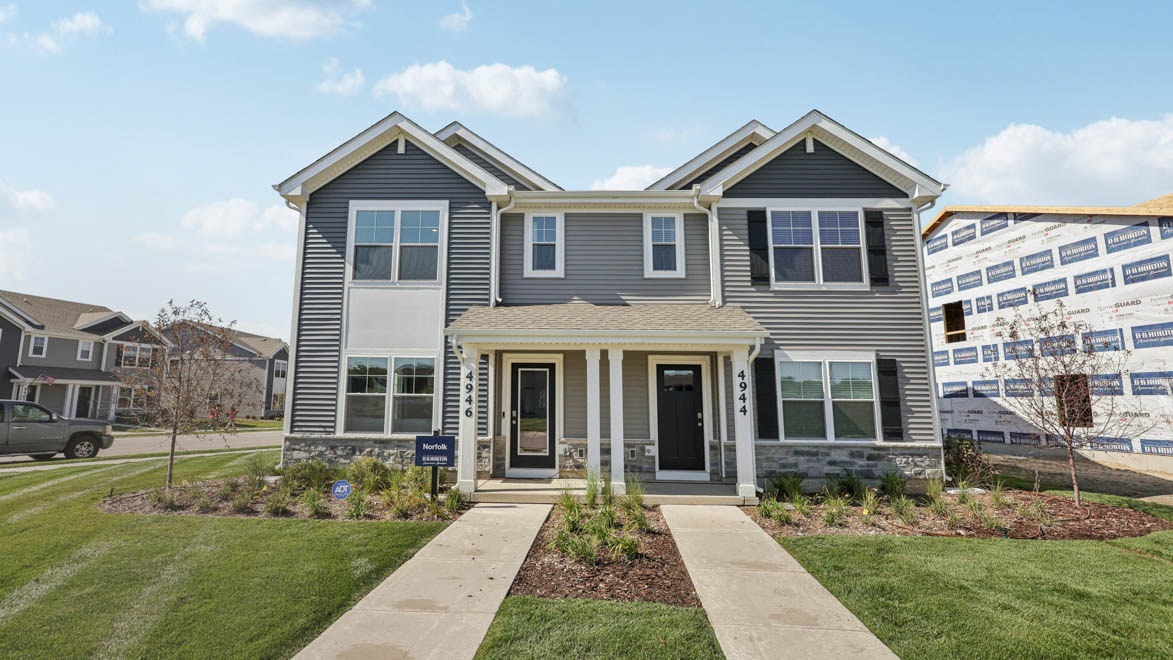condo duplex exterior with stone wainscot