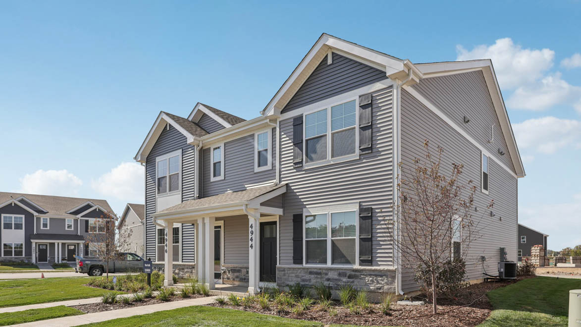 condo duplex exterior with stone wainscot