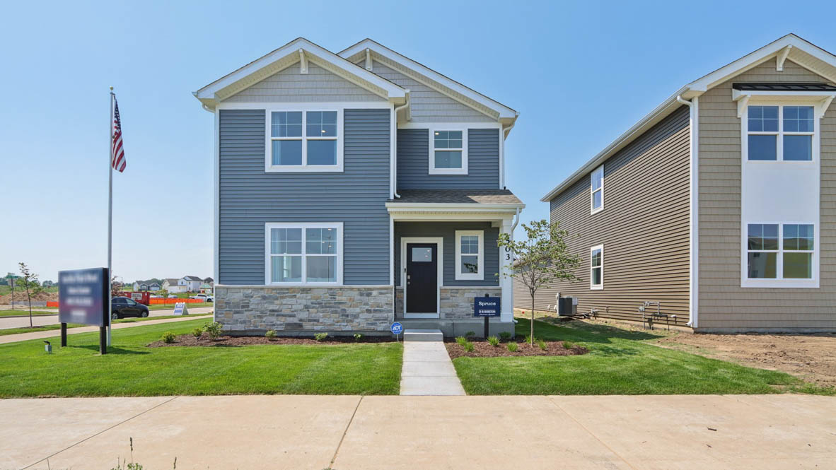 Exterior two-story home with stone detailing