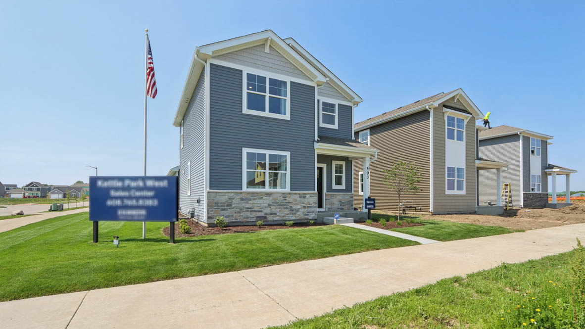 Exterior two-story home with stone detailing