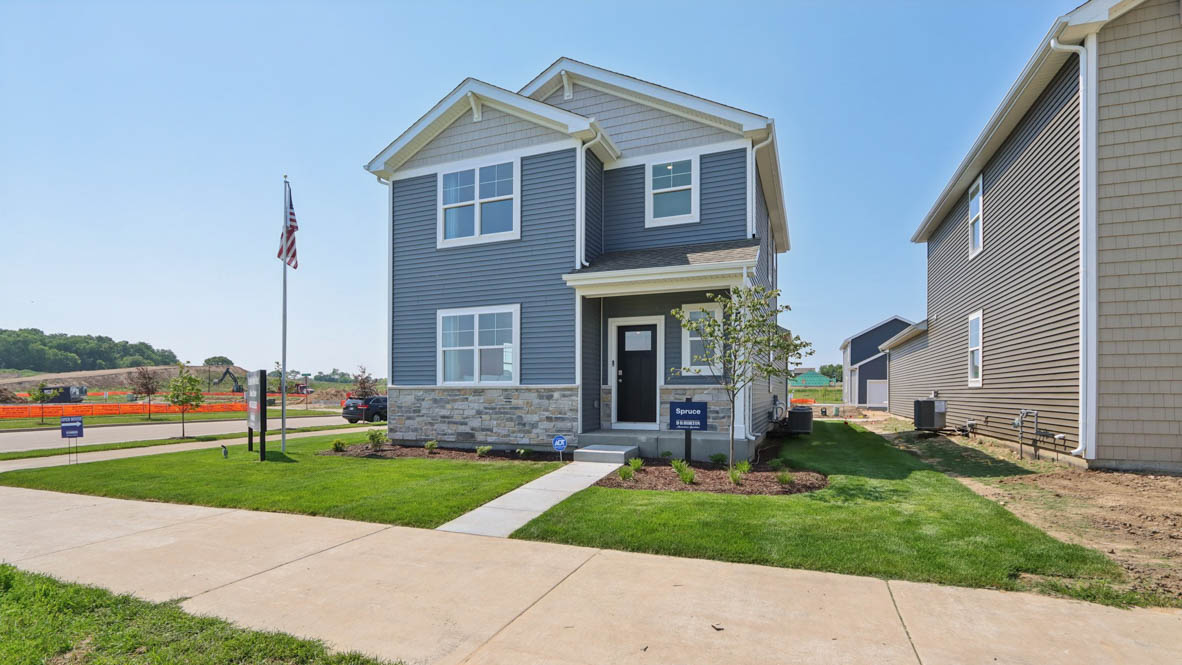 Exterior two-story home with stone detailing