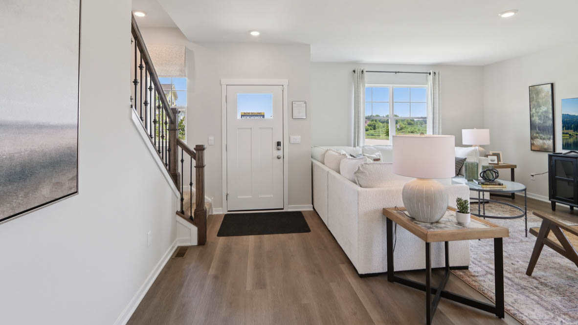 Interior entry-way open to living area and staircase