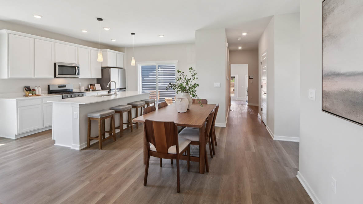 Interior dining area open to kitchen with center island
