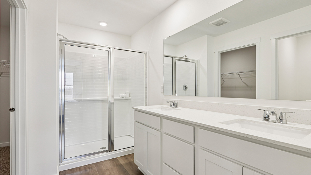 primary bathroom with dual bowl vanity