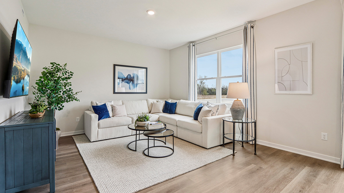 open concept living room with vinyl flooring