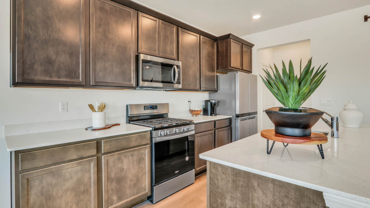 open concept kitchen with spacious island and flagstone cabinets