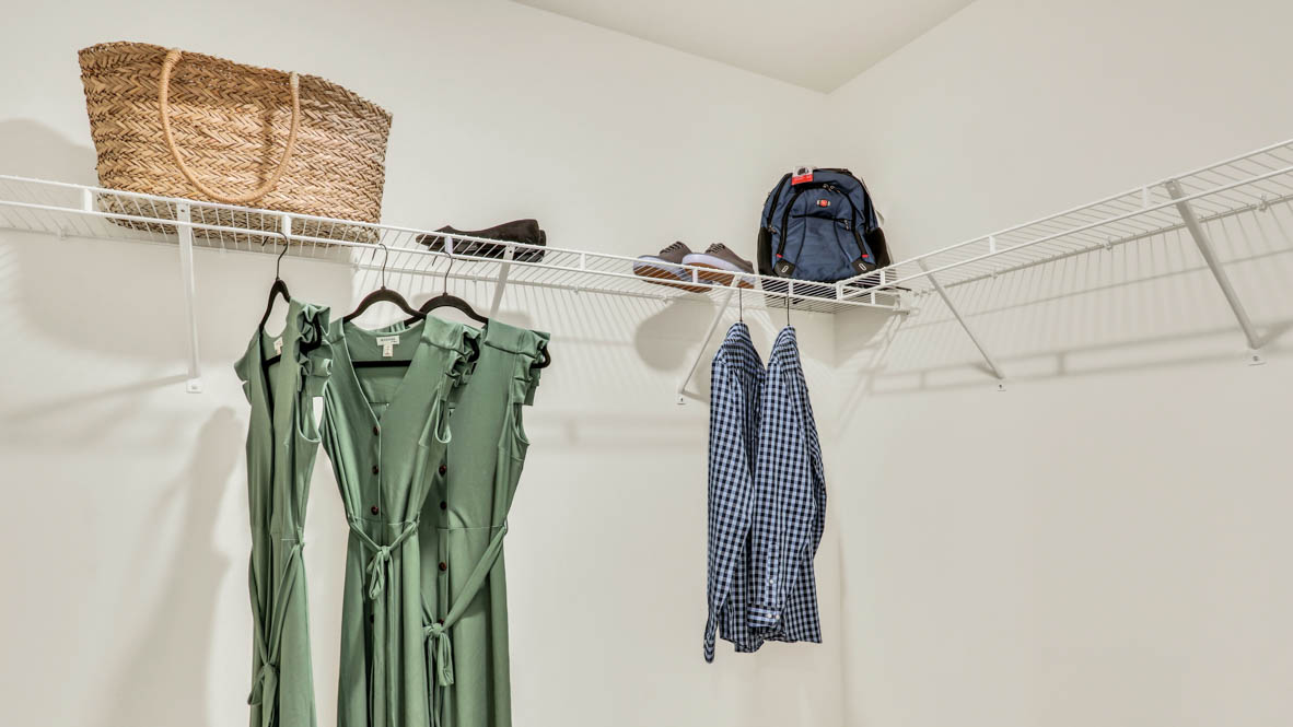 primary en suite bathroom with walk-in closet