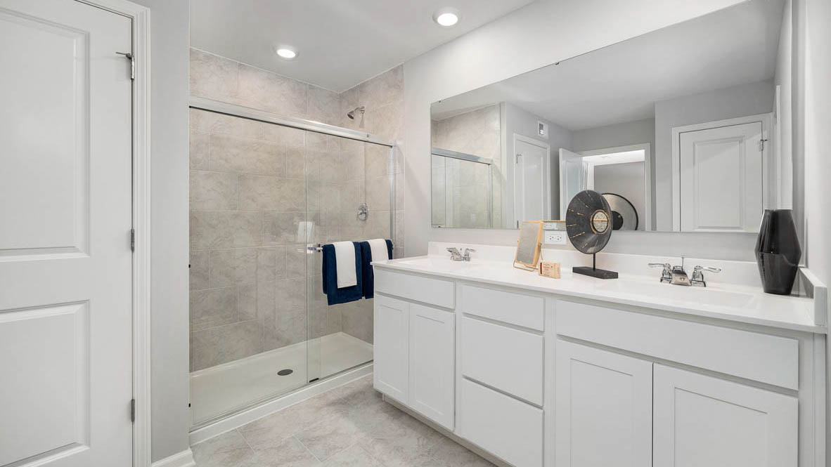 primary en suite bathroom with double bowl vanity