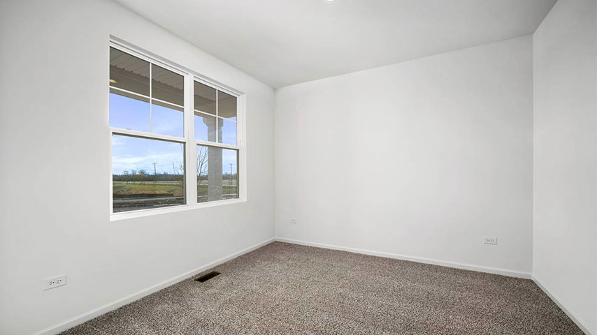 secondary bedroom with carpeted flooring