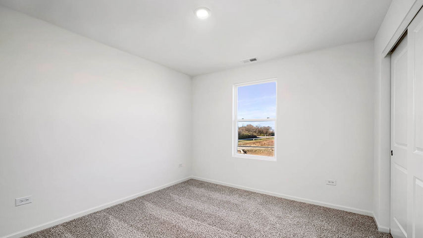 secondary bedroom with carpeted flooring