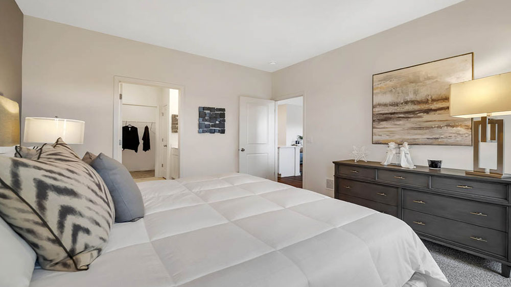 Primary bedroom with connecting en suite