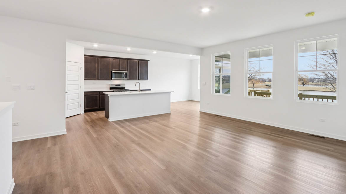 open concept living room with vinyl flooring