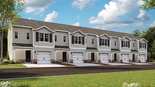 Two story townhome with vinyl siding and stone