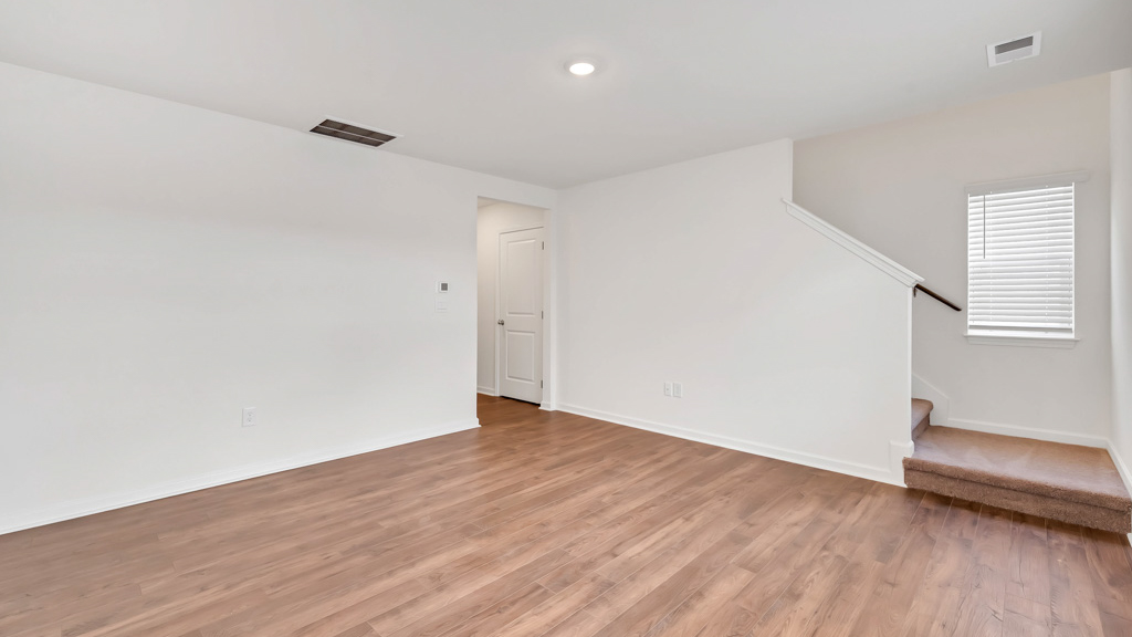 Open living and great room area with ample natural light