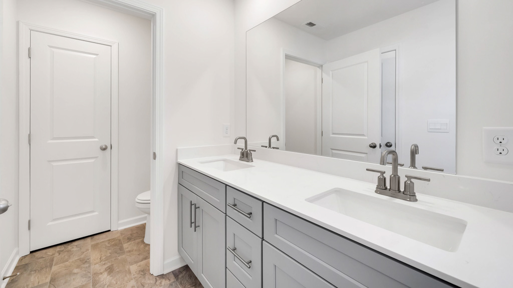 Primary bathroom with private water closet and walk-in closet